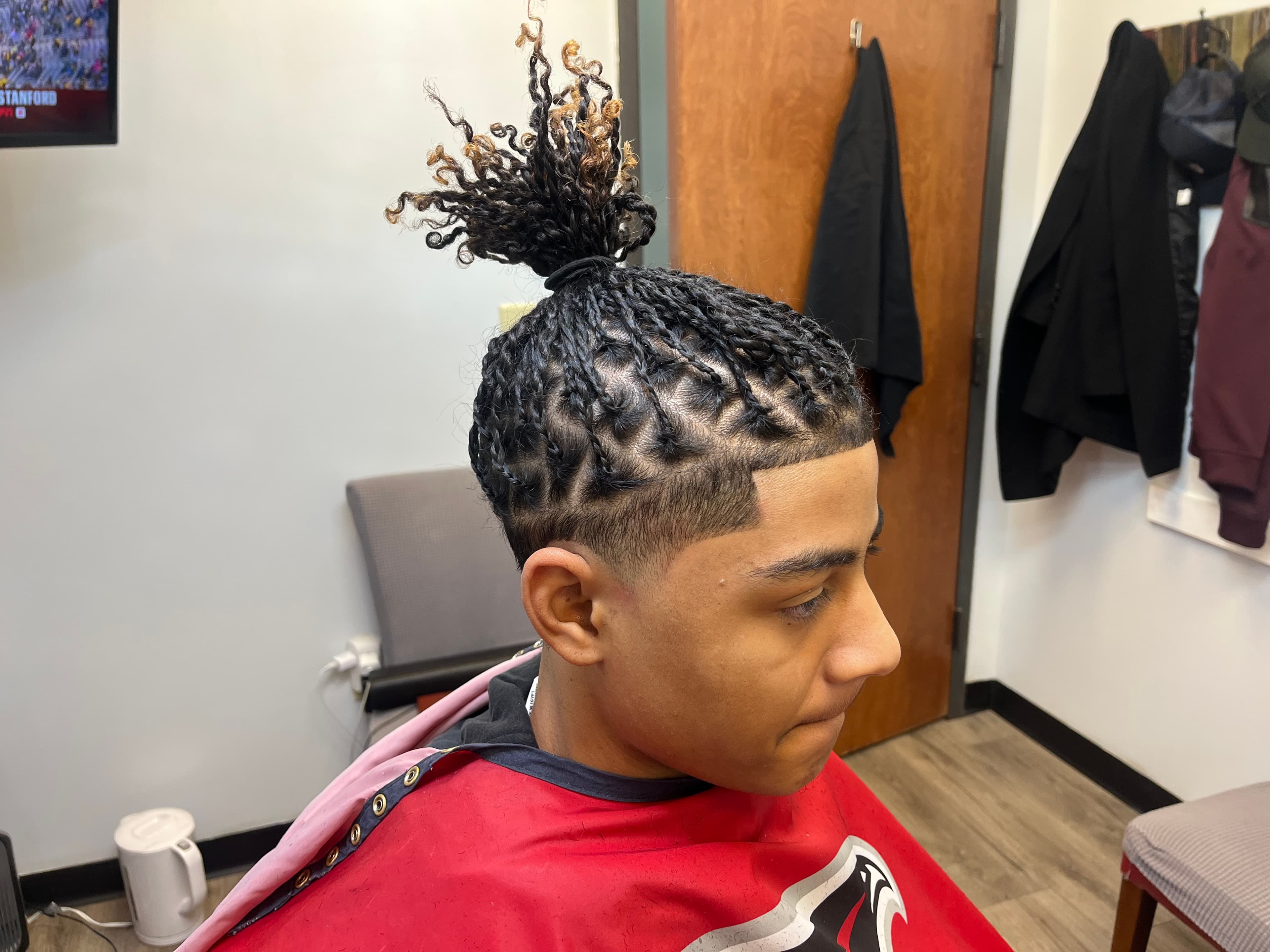 Braids with skin fade by Garland Cuts barber in Suwanee